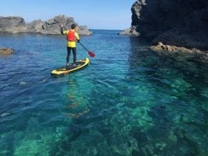 SUP and clear blue water on the coast